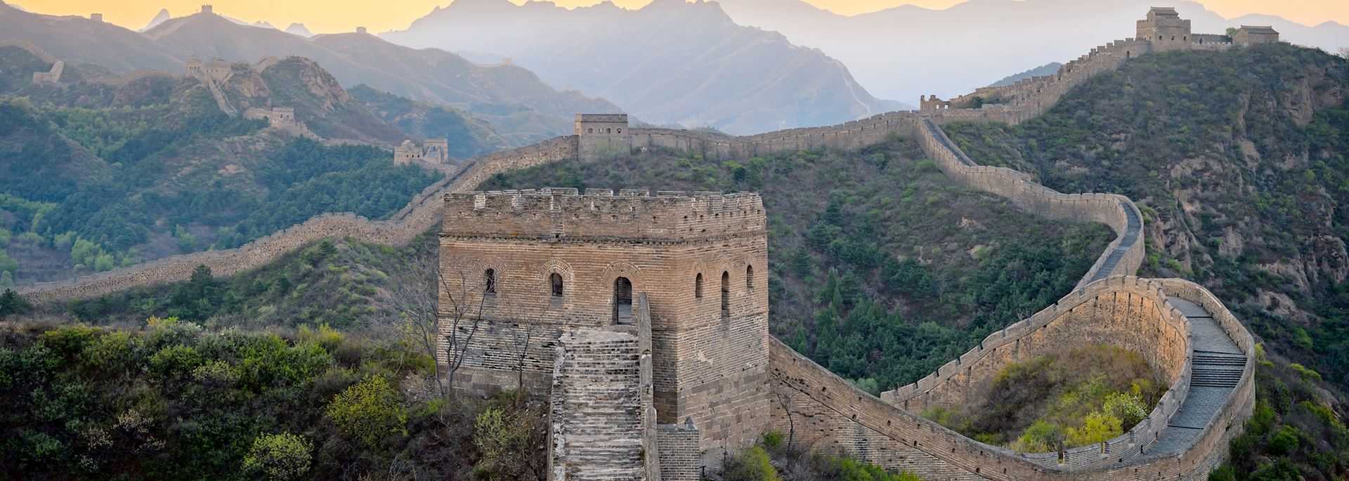 Dawn breaking over the Great Wall of China in Jinshanling